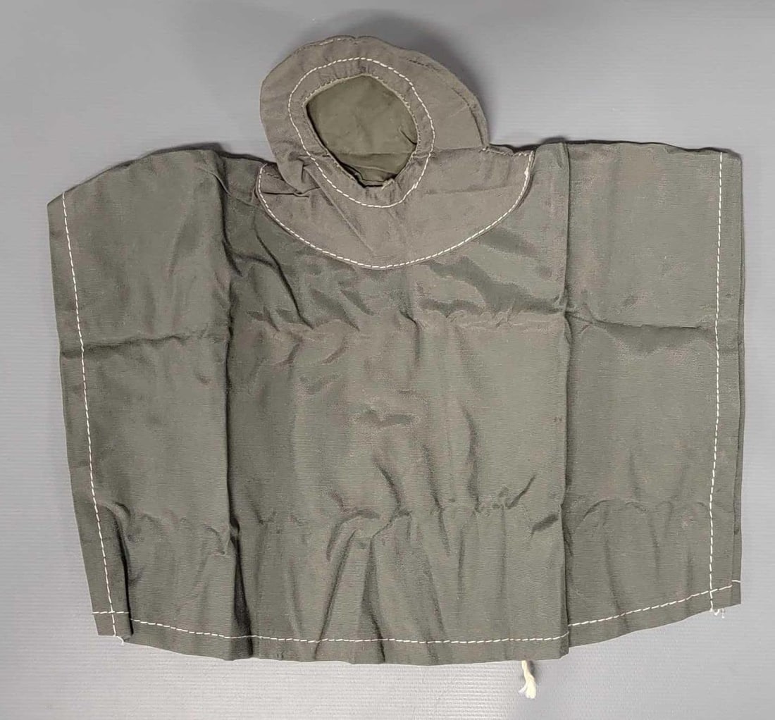 Early Hasbro GI Joe poncho with round snaps: Early Hasbro GI Joe poncho with round snaps, it has been folded so there are creases but it is soft and supple, not hard and crusty.