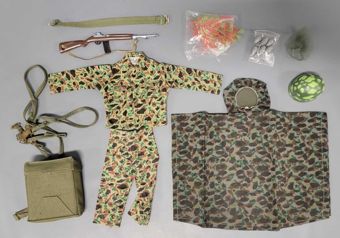 Hasbro GI Joe Marines accessories: Hasbro GI Joe Marines accessories to include shirt, pants, poncho, field radio, carbine, helmet, netting, camouflage, unopened pack of grenades and parachute pack, all in very good to near mint condit