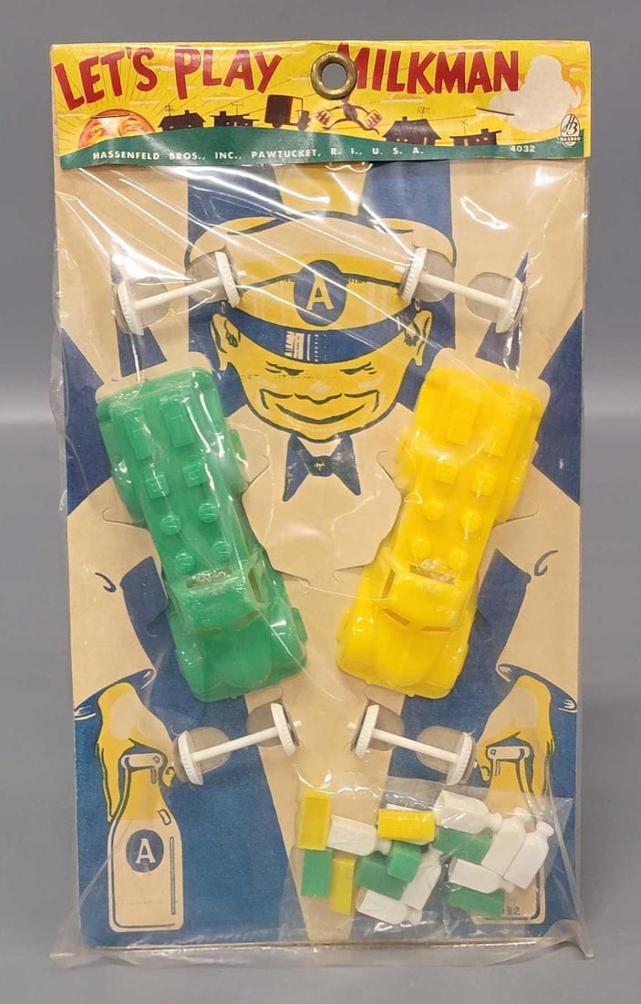 Scarce Hassenfeld Brothers Let's Play Milkman on sealed header card: Scarce Hassenfeld Brothers Let's Play Milkman on sealed header card. A great grocery store on five and dime toy set with two plastic trucks and a sealed bag of milk, eggs and butter accessories. T