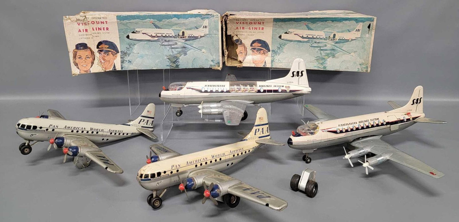 Group of tin lithographed toy airplanes with two original boxes for parts or restoration: Group of tin lithographed toy airplanes with two original boxes for parts or restoration. Includes two Tomiyama Japan tin lithographed battery operated Scandinavian Viscount air liners that do not wor