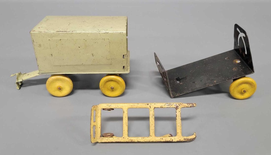 1930's Girard Wyandotte pressed steel box trailer with tongue and partial tipper trailer: 1930's Girard Wyandotte pressed steel box trailer with tongue and partial tipper trailer. The box trailer is in nice shape with play wear but perfect wooden wheels. The tipper trailer is missing t