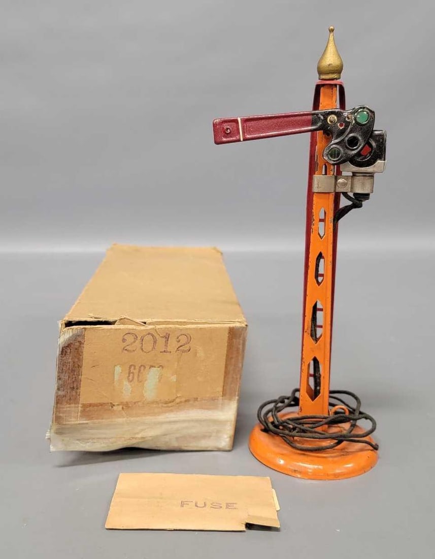 American Flyer prewar 2012 manual control electrically lighted semaphore in OB: American Flyer prewar 2012 manual control electrically lighted semaphore in original box. The accessory is C7- and comes with an O gauge track section with activator and power connector in a very plai