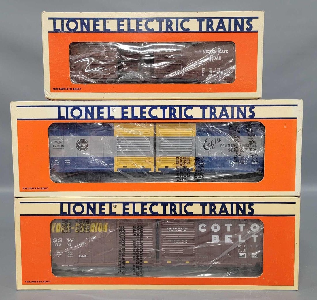Three Lionel modern O double-door box cars in original boxes (1 of 2)