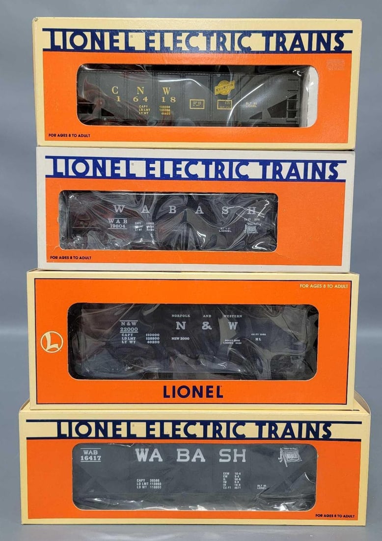 Four Lionel modern O hoppers in original boxes: Four Lionel modern O hoppers in original boxes to include 19804 Wabash and 19885 Norfolk and Western operating hoppers plus 16417 Wabash 4-bay and 16418 Chicago and Northwestern 2-bay, C8-9 in fair to