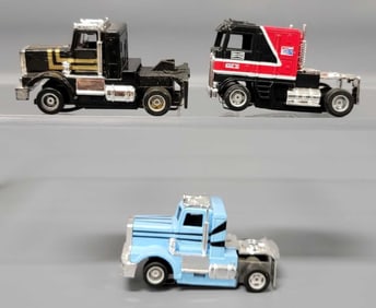 Three Tyco US 1 trucking semi tractors slot cars