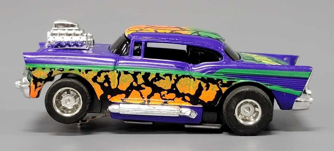 Tyco 57 Chevy HO slot car purple Venom: Tyco 57 Chevy HO slot car purple Venom, car is near mint to mint on an unrun chassis. This has been tested with a 9 volt battery and runs perfectly.