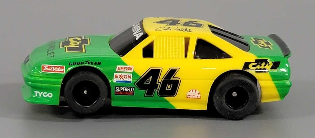 Tyco HO Cole Trickle #46 City Chevrolet Lumina Slot Car: Tyco HO Days of Thunder Cole Trickle #46 City Chevrolet Lumina Slot Car. It is green and yellow with LUMINA across the windshield, racing decals including Goodyear, Exxon, Superflo and many others. Th