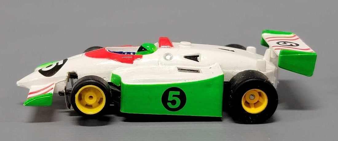 Tyco HO #5 white, red and green Indy / F1 Slot Car: Tyco HO #5 white, red and green Indy / F1 Slot Car, car is excellent to near mint on an unrun chassis. This has been tested with a 9 volt battery and runs perfectly.