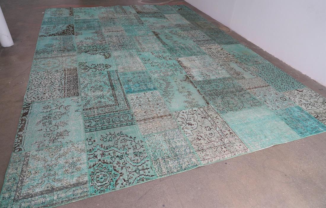 Green Over Dyed Antique Turkish Patchwork Rug: This is a very unique Hand-knotted rug, fashioned from sections of Turkish antique rugs ranging from 50 to 80 years old, is over-dyed in a vibrant green. Hand sewed edges. A backside is cotton non-sli