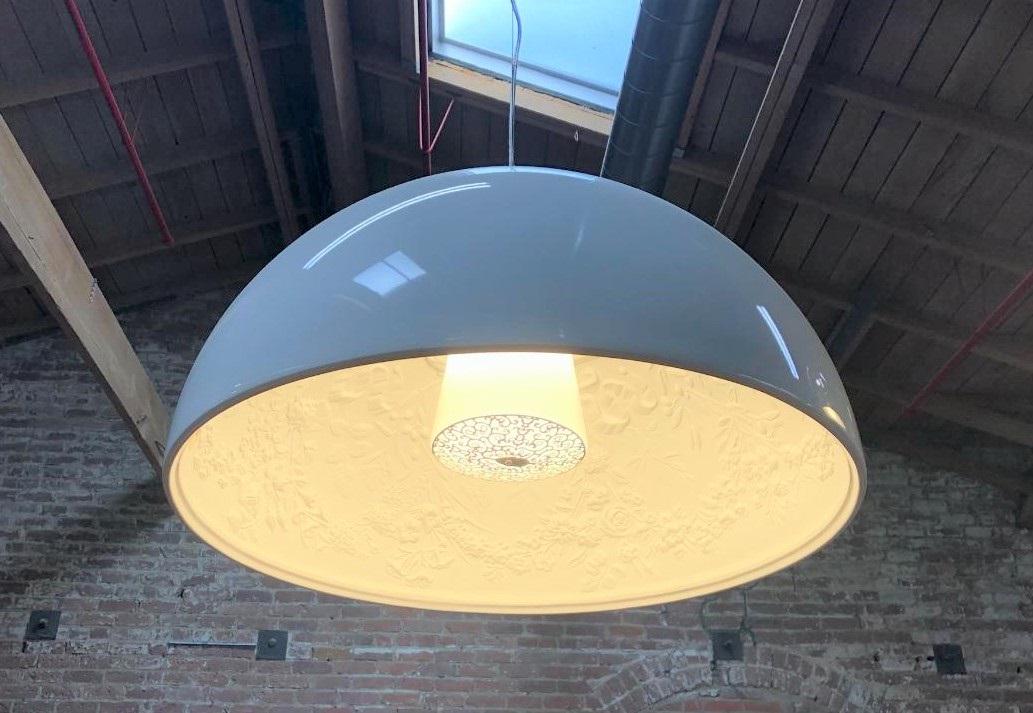 FLOS Skygarden 1 White Hanging Pendant Lamp: Designer/Artist/Manufacturer: Marcel Wanders for FLOS Country of Origin & Materials: Italy, plaster, glass, and stainless steel Additional Information: A gracefully hanging hemisphere, the pendant lam