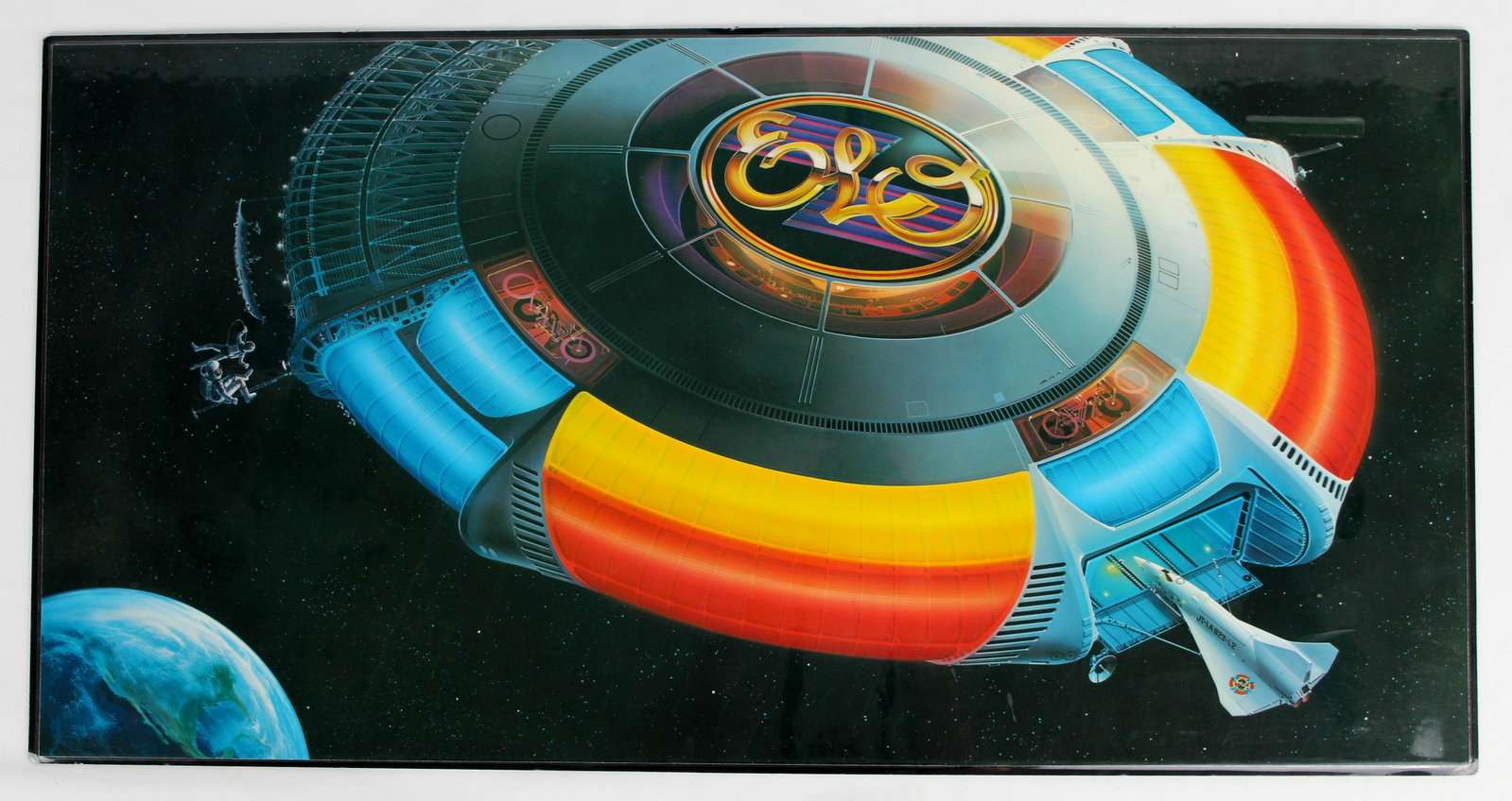 ELO Album Cover Desk Mat or Art: ELO, Out of the Blue, Album Cover Desk Mat Printed, laminated and mounted on thin rubber foam, this feels like a placemat or desk pad / mouse mat. Could be framed or used on a desk or table top. This 