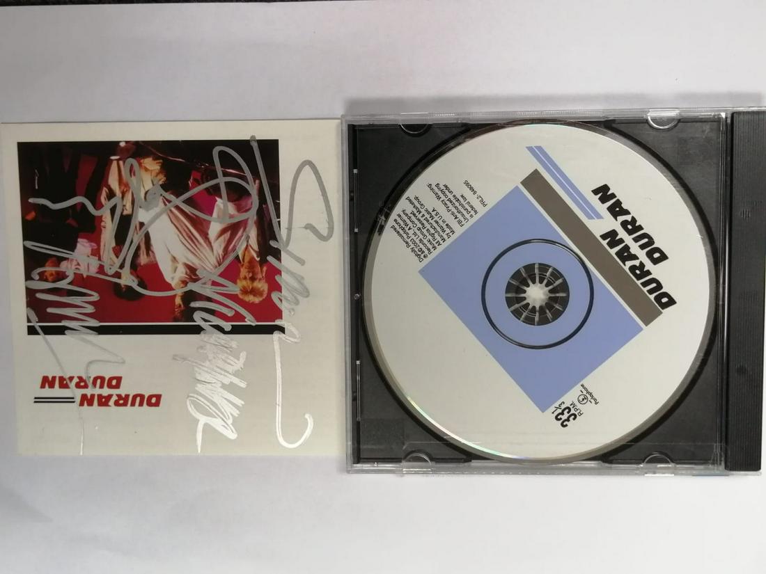 Duran Duran - Duran Duran CD Disc + Booklet Autographed: Autographed by: Dominic Brown, Simon Le Bon, Nick Rhodes, John Taylor, Roger Taylor All items come with COA which has professional authentication services by experts. Certificate come with unique silv