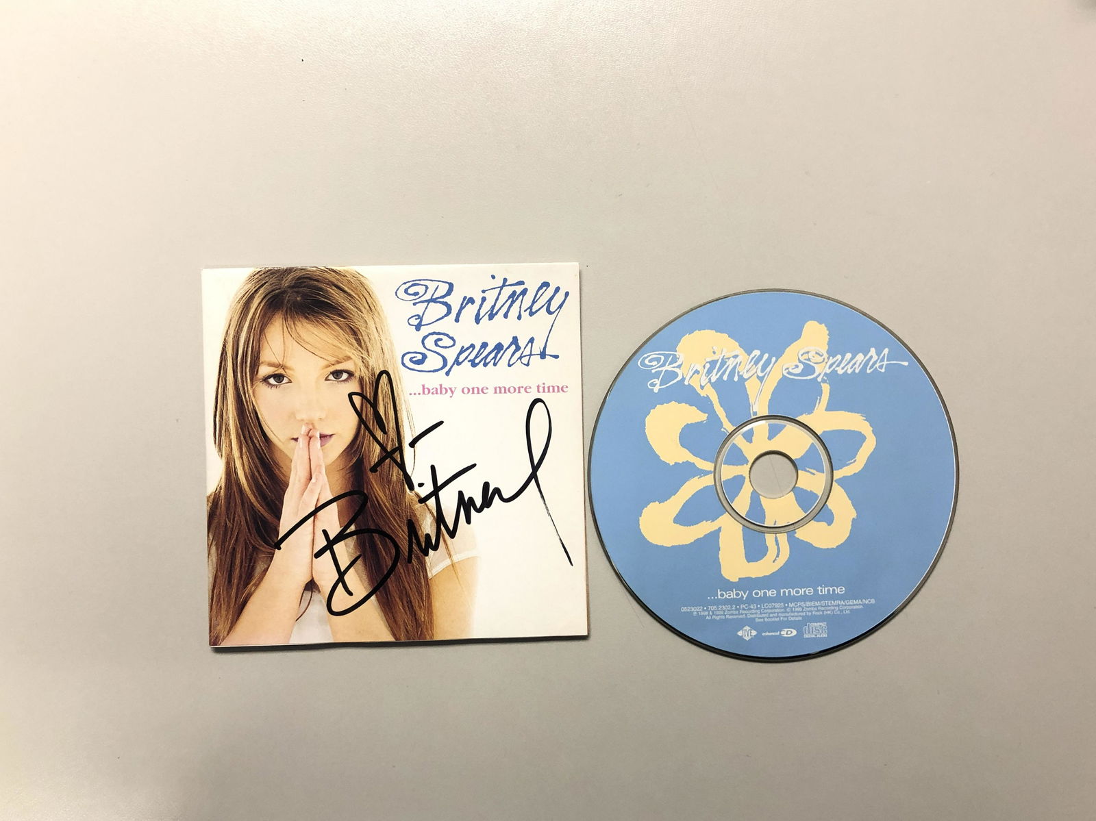 Britney Spears Baby One More Time SIGNED CD Booklet: Autographed by: Britney Spears All items come with COA which has professional authentication services by experts. Certificate come with unique silver hologram and serial number autograph. Items might