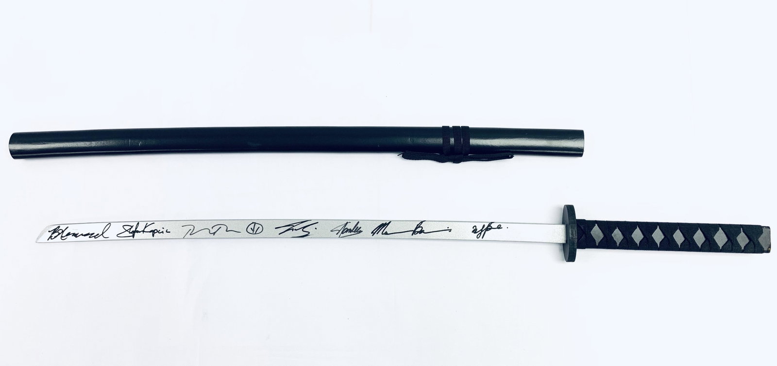 Marvel Deadpool Sword Autograph Signed Ryan Reynolds: Autographed by: Ryan Reynolds, Josh Brolin, Morena Baccarin, Zazie Beetz, Stefan Kapicic, Brianna Hildebrand, Stan Lee Product Description: Hard Wood Made Sword with 40 inches long All items come with