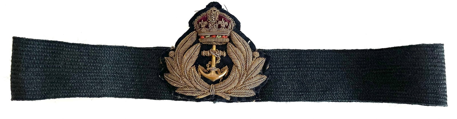 WW1.UK Royal Navy Officers Peak Cap Band: Wire embroidered badge sown onto cap band.Kings crown and metal anchor.