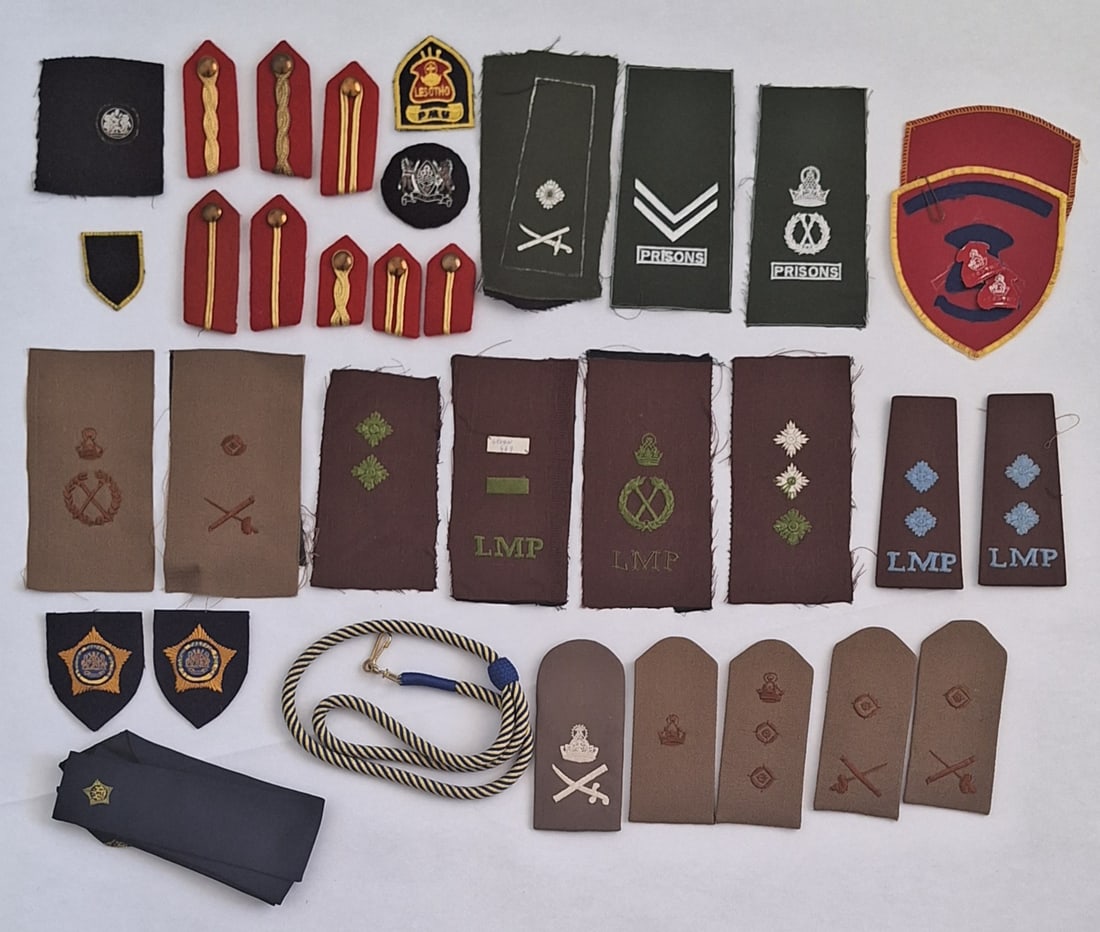 AFRICAN COUNTRY LESOTHO.Military & Prisons Collection of Badges: Collection of badges ,rank ,lanyard and gorgets.Some unfinished production samples
