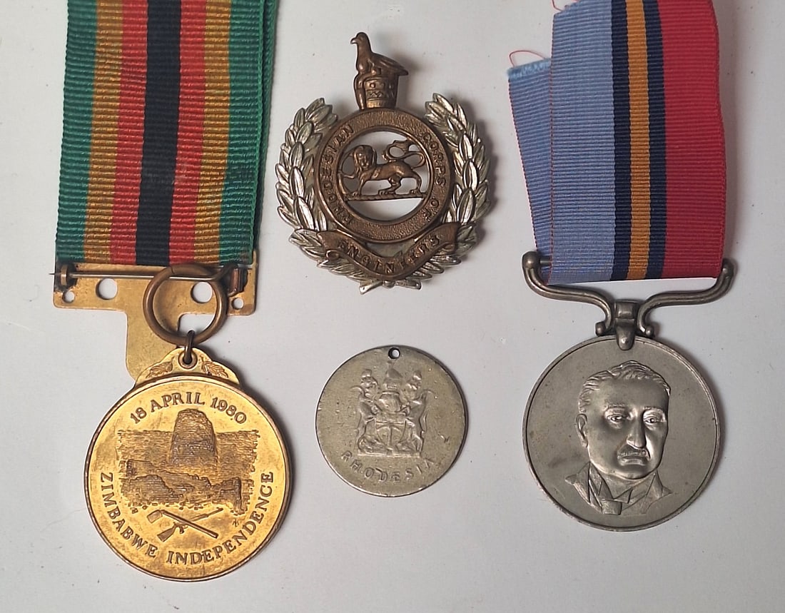 RHODESIA.Rhodesian Corps Of Engineers Medal Set with Badge: Rhodesian GSM with Zimbabwe Independence to a Sapper 113935 SPR R.R. DA CRUZ.Comes with his cap badge and Rhodesian token