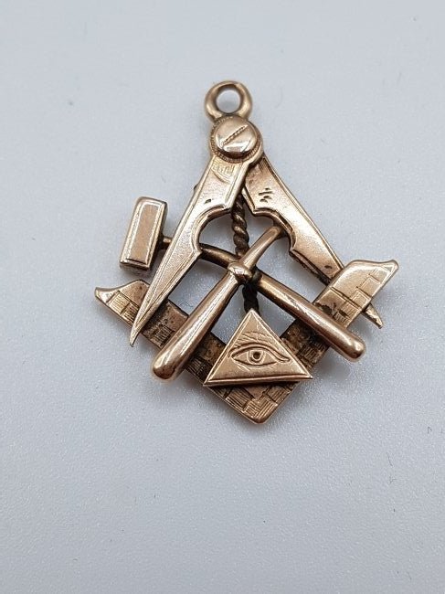 Masonic Gold Pendant - 333 Fine Gold: Masonic Gold pendant made from 333 fine gold and weighs 2.78 grams! This pendant represents the framing square and compass, as well as the eye that sees everything. It also has a spade and another ins