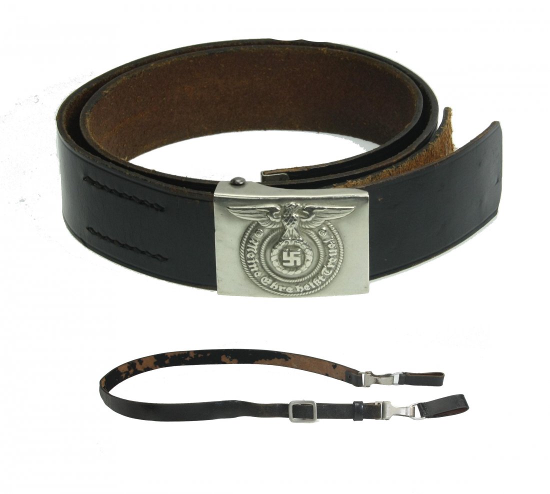 A SS set belt buckle + leather belt + cross strap.: The Allgemeine-SS, was originally formed in May 1923 under the auspices of the SA, Sturm Abteilung, (Storm/Assault Detachment), as the Stosstrupp Adolf Hitler (Shock Troops), and was redesignated Schu
