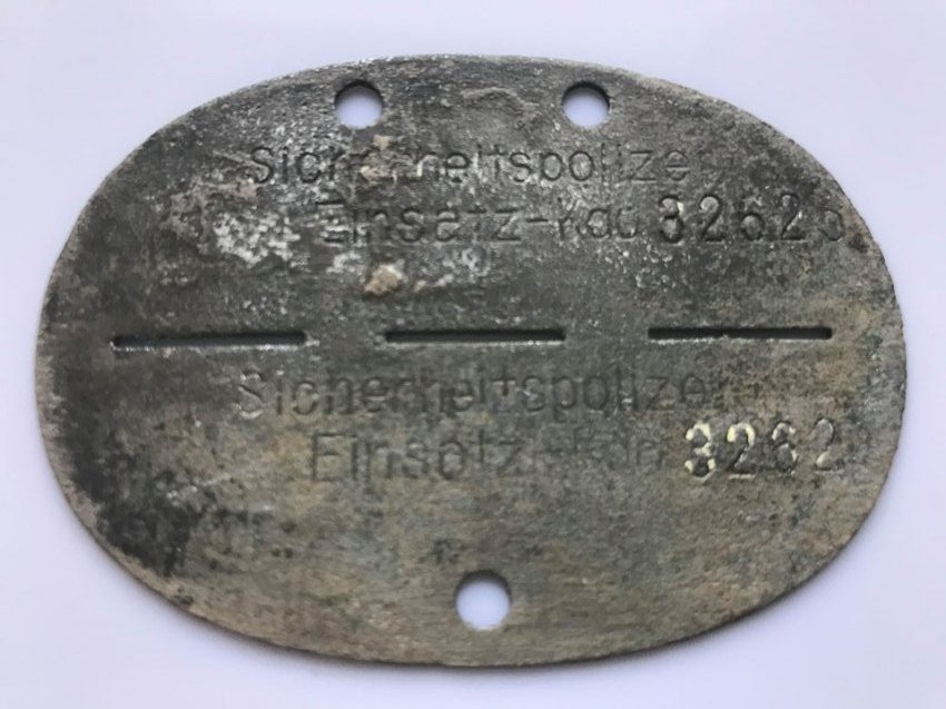 Scarce ID Tag of Infamous Einsatzgruppen Member - WW2: Super scarce ID tag of a member of the infamous Einsatzgruppen, the mobile killing squads, recovered in Finland!We offer for sale this ultra rare ID tag of a member of the infamous Einsatzgruppen, the