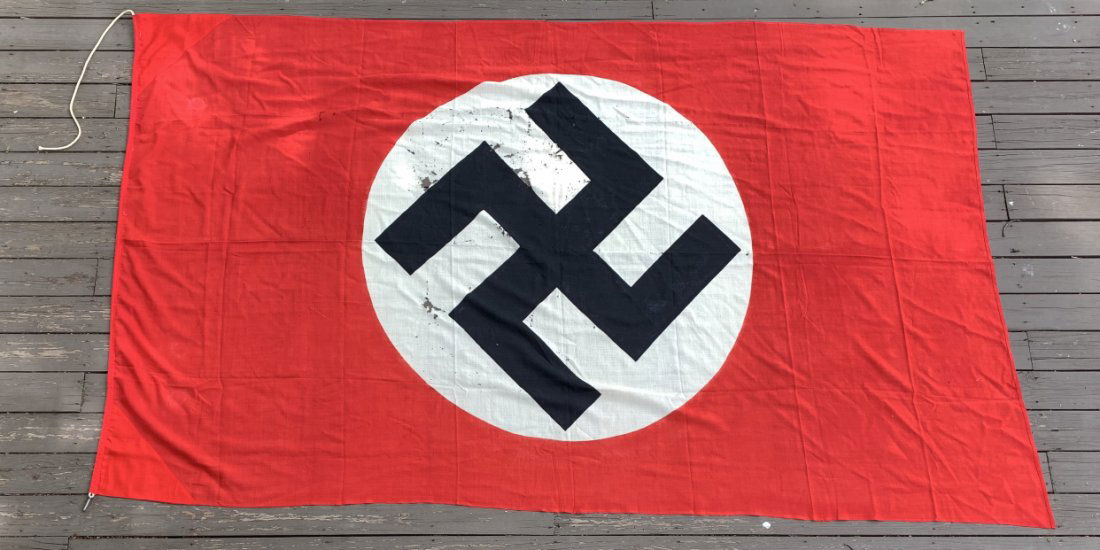 German WWII NSDAP Flag 10 ft x 6 ft - Used Condition: III Reich WWII NSDAP flag 10 ft x 6 ft in used conditon. Original rope still present and 1 metal clasp functioning. The flag is stamped "NSDAP Gauleitung Kurhessen Verwaltung" (NSDAP Administration of