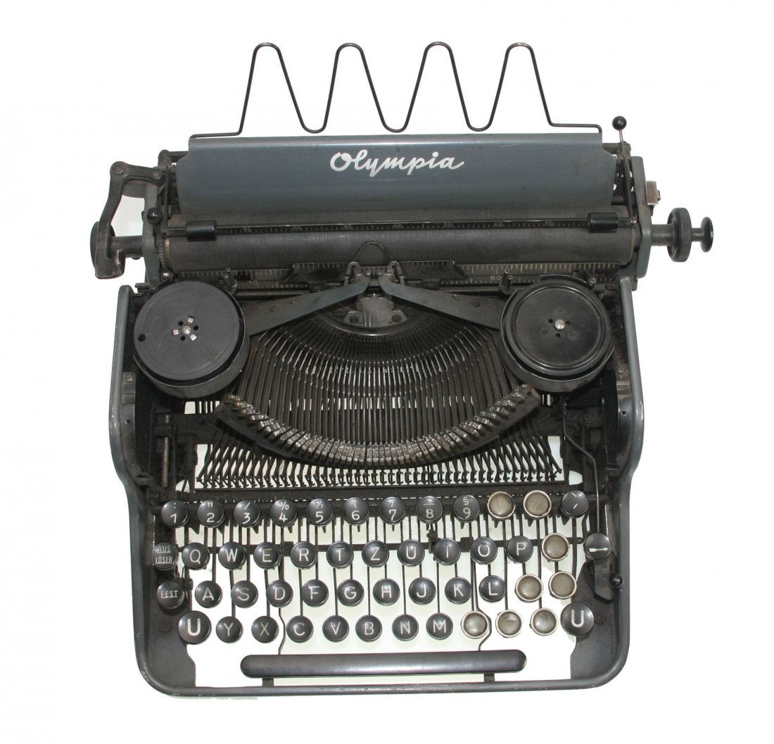German typewriter OLYMPIA with SS key: German typewriter OLYMPIA from the Third Reich. Complete, efficient. The key with the SS runes is noteworthy. Several keys listed.