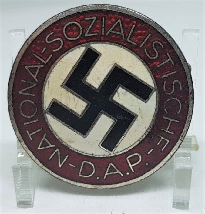 NSDAP MEMBERSHIP BADGE RZM M1/128: NSDAP membership badge "M1/128"(Parteiabzeichen). Standard issue membership badge awarded to all personnel on acceptance as an official party member. Roughly 23mm diameter, die struck alloy badge NSDA