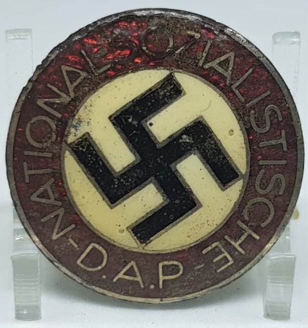 NSDAP MEMBERSHIP BADGE RZM M1/130: NSDAP membership badge "M1/130"(Parteiabzeichen). Standard issue membership badge awarded to all personnel on acceptance as an official party member. Roughly 23mm diameter, die struck alloy badge NSDA