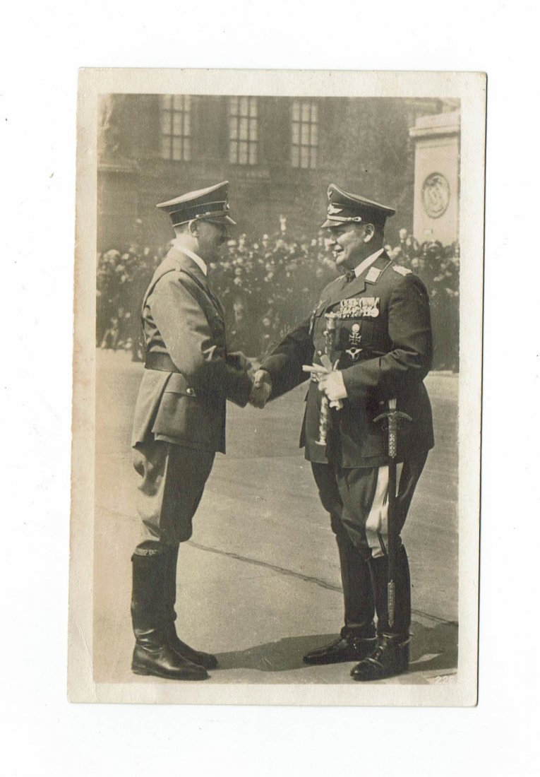 PROPAGANDA POSTCARD OF HITLER AND GOERING SALUTING: Never used propaganda postcard where we can see Adolf Hitler shaking the hand of the Reichsmarschal Hermann Göring during a parade.