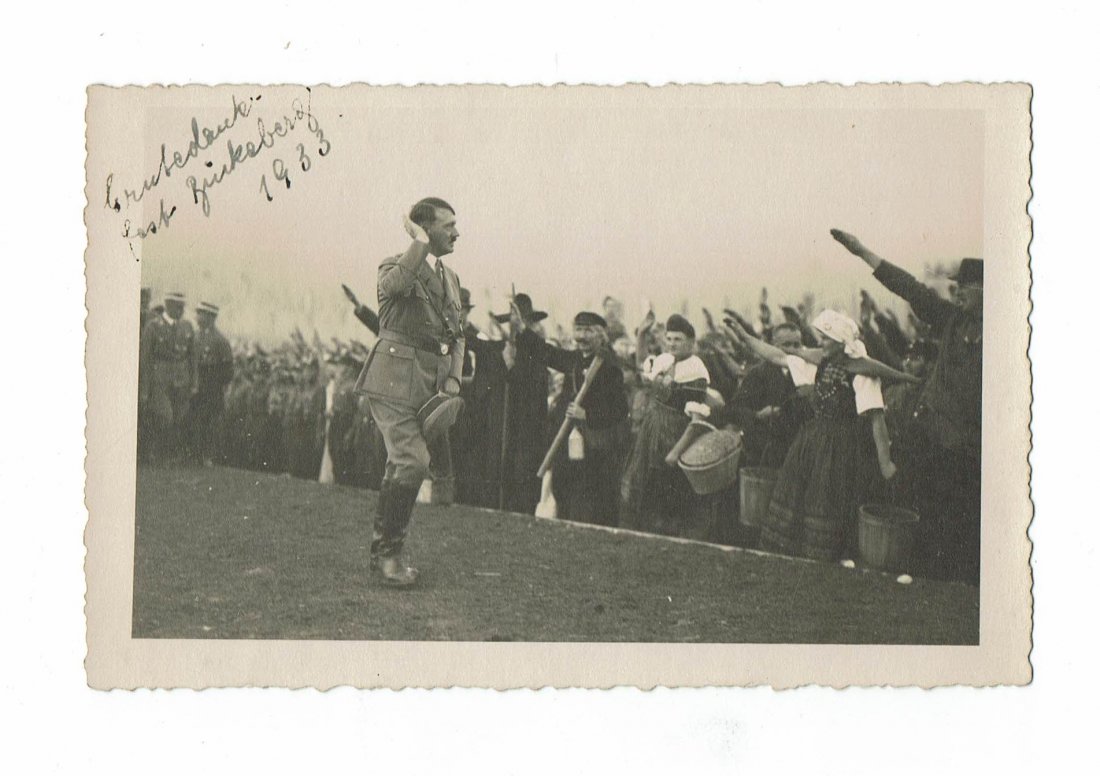 HITLER PRIVATE PHOTO - 1933 ERNTEDANKFEST BUECKEBERG: Postcard size Adolf Hitler's private taken photo during his visit to the Erntedankfest in Bückeberg in 1933. We see him saluting the citizens.