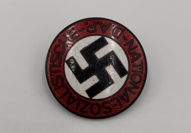 NSDAP BADGE M1/34 RZM: NSDAP membership badge "M1/34"(Parteiabzeichen). Standard issue membership badge awarded to all personnel on acceptance as an official party member. Roughly 23mm diameter, die struck alloy badge NSDAP