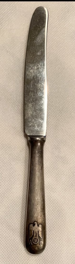 ADOLF HITLER SILVER KNIFE INFORMAL PATTERN: Adolf Hitler Informal Berghof Pattern knife. Adolf Hitler's personal cuttlery mark with eagle and AH initials in relief. Very nice piece. 800 Sterling Silver made spoon with maker mark.