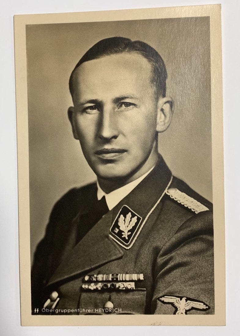 Reinhard Heydrich Postcard with Death Mask Stamp! 1943: Reinhard Heydrich Postcard with an official portrait of the "Butcher of Prague", one of the most influential and powerful personalities of the close cirle of Adolf Hitler. On the reverse it bears the 