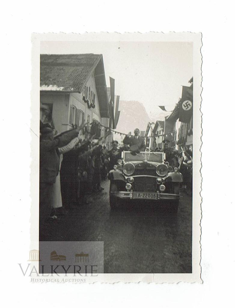 Photo of Hitler Visiting Garmisch During Winter Olympic: Private taken photo of Adolf Hitler visiting Garmisch-Parterkirchen in 1936 during the winter olympics that took place in that German city. We see the Führer greeting the citizens from his car. Descr