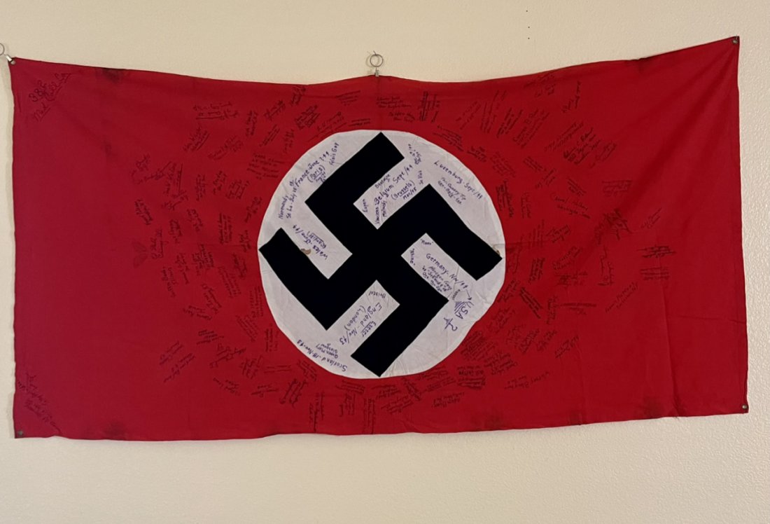 NSDAP Signed Flag - US Vet Bring Back: NSDAP Signed Flag, US Vet Bring Back. This is a NSDAP vehicle flag with metal eyes on each side. The flag measures 75 inches x 39 inches. Great shape. Signed by several US GI's.