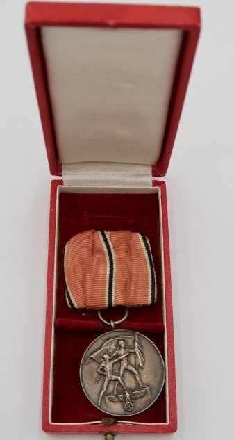 Cased Anschluss Commemorative Medal Parade Mounted: Cased Anschluss commemorative medal with Prussian parade mount ribbon configuration and nice patina of use. It comes with case of issue in very good condition.The Anschluss Commemorative Medal (German