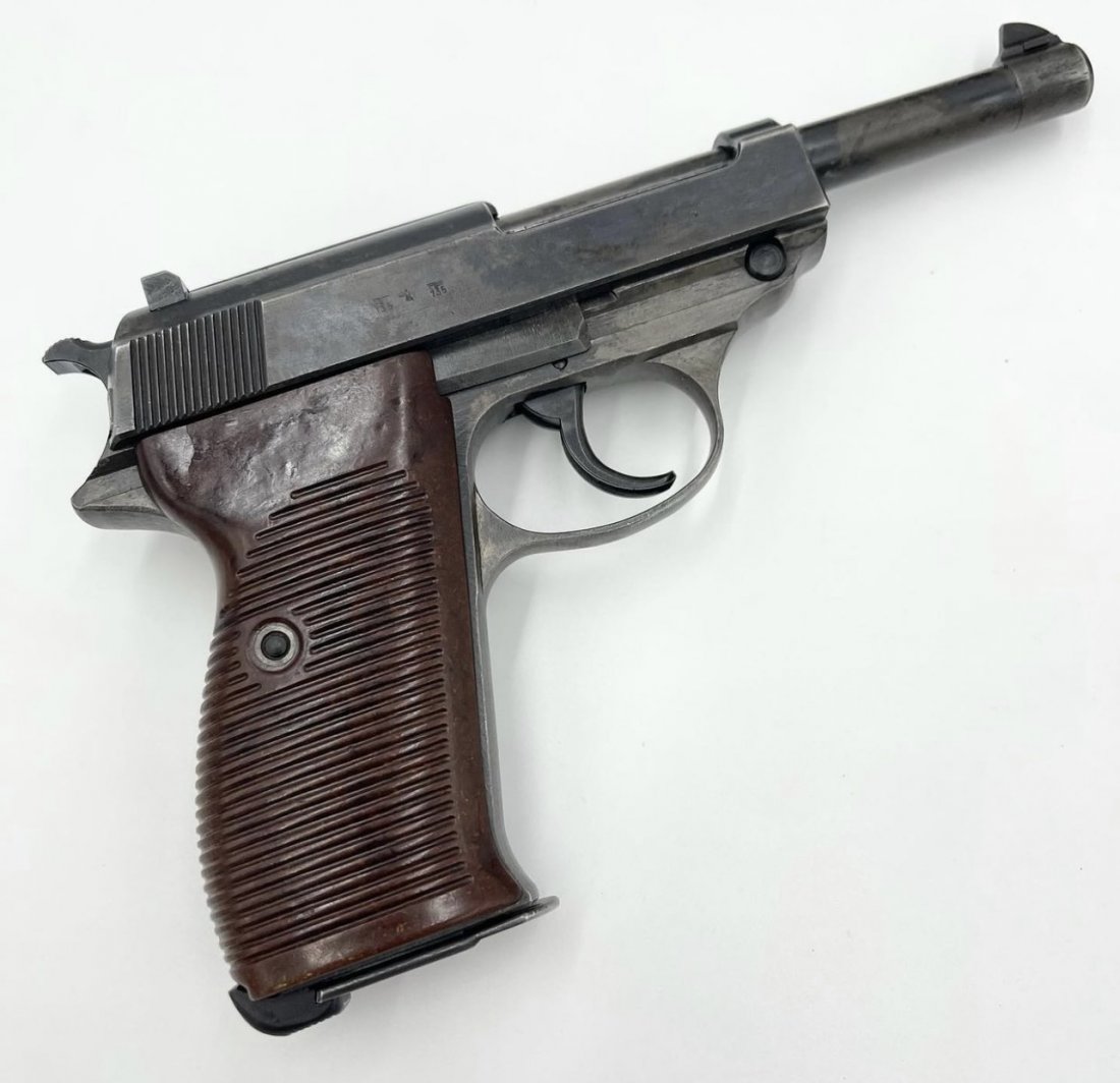 Nazi Mauser P.38 - byf 43: Originally issued to the Nazi military in 1943. The gun is all matching and has the proper "Eagle 135" military proofs. The Walther P.38 is a 9 mm semi-automatic pistol that was developed by Carl Walt