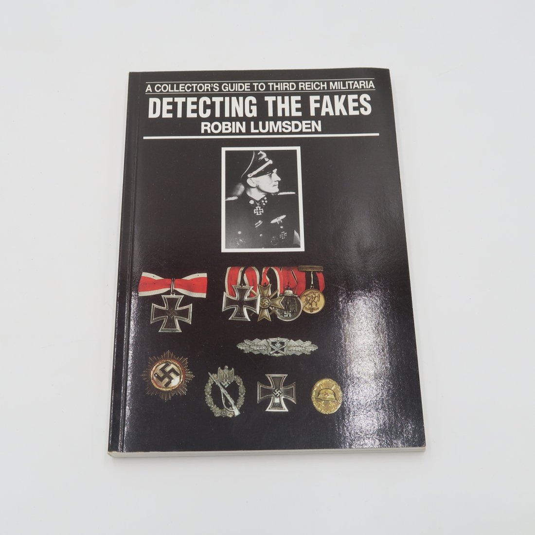 Detecting the Fakes by Robin Lumsden: first published in 1994, offers guidance to collectors and others on the subject of their uniforms and insignia. An invaluable reference which provides a graphic selection of wartime photographs showi