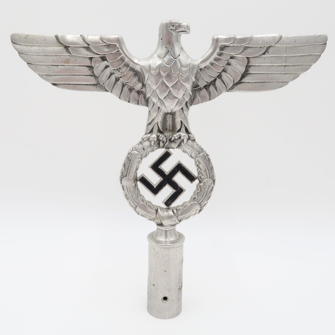 NSDAP Eagle Flag Pole Topper: Aluminum NSDAP flag pole topper, 10 x 9.75 in., a national eagle and wreathed swastika. This topper is RZM - marked 'M3/34/35' at the base.