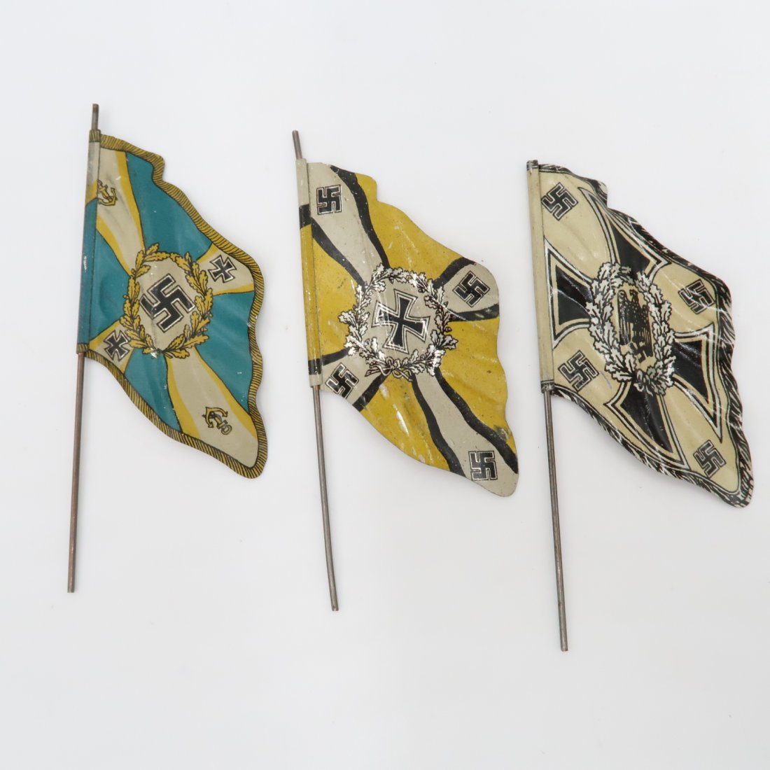Nazi Tin Flags - Set of 3: Nazi Tin Flags - Set of 3. Two Heer flags and a Luftwaffe. Length of poles vary, around 34-4 inches each.