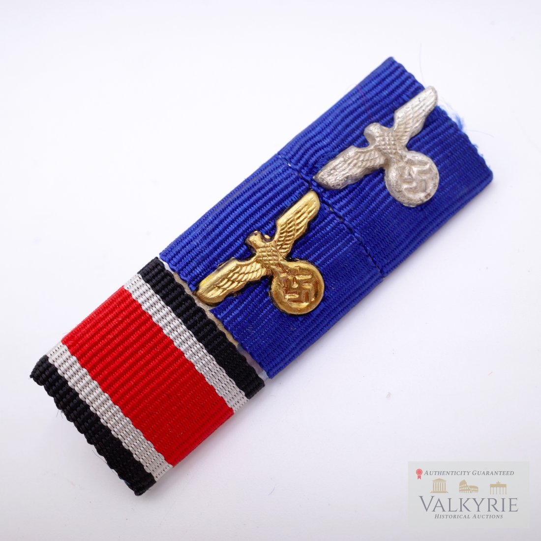 Nazi German Three Place Ribbon Bar: The three place ribbon bar consists of a 1939 Iron Cross 2nd Class, The Wehrmacht 12 year long service medal with gold eagle cipher, and The Wehrmacht 4 year long service medal with silver eagle ciphe