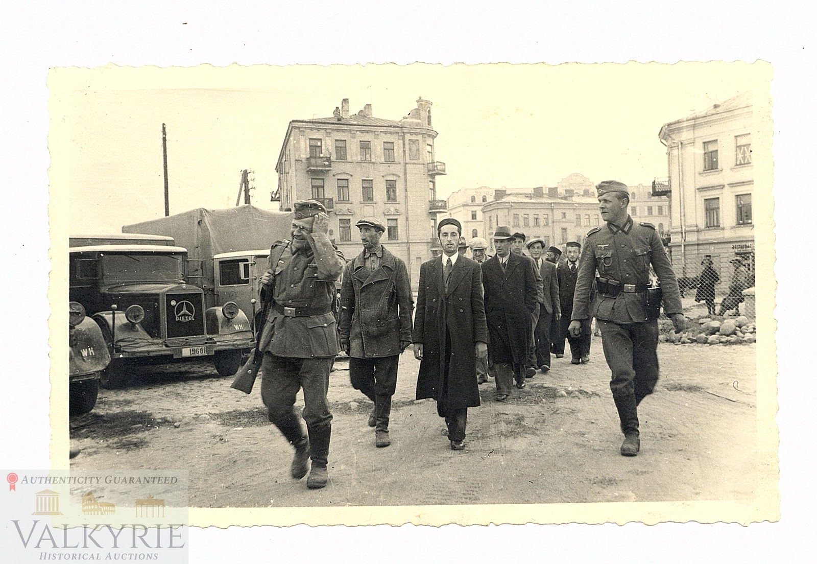 Excellent Postcard Size Photo Taken in Lublin Ghetto With Jews Taken by German Soldiers: Excellent postcard size photo taken in the Lublin Ghetto where we can see some Jews being taken to an unknown place by some German soldiers. On the back we can see the Rabbi Jeshiwa School. Photo is p