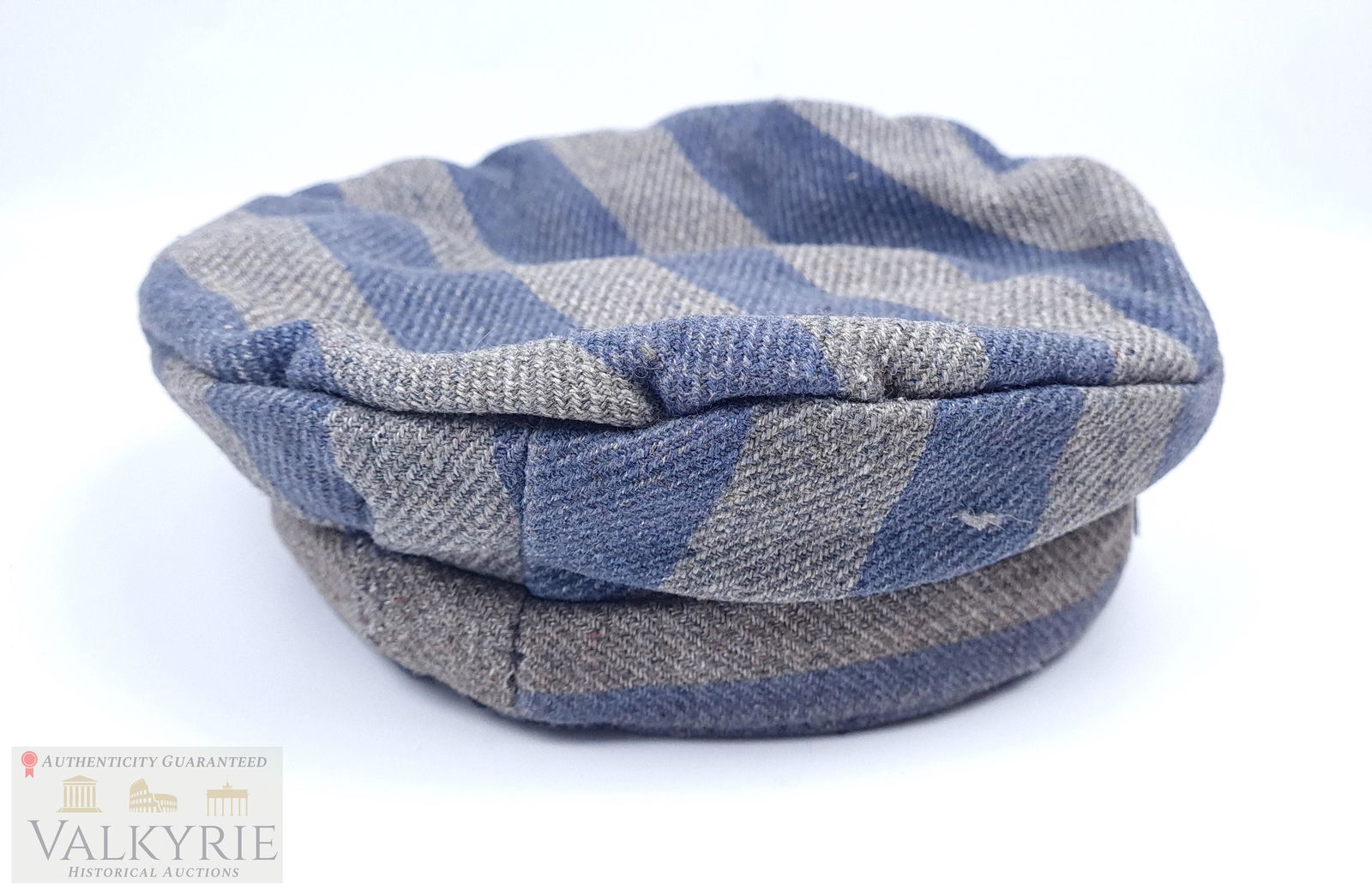 Ultra Rare Original Concentration Camp Inmate Uniform Cap in Excellent Condition: We offer an ultra rare original concentration camp inmate uniform cap in excellent condition. It is made from thick legit striped fabric for winter period with gray and blue stripes. This model was ve