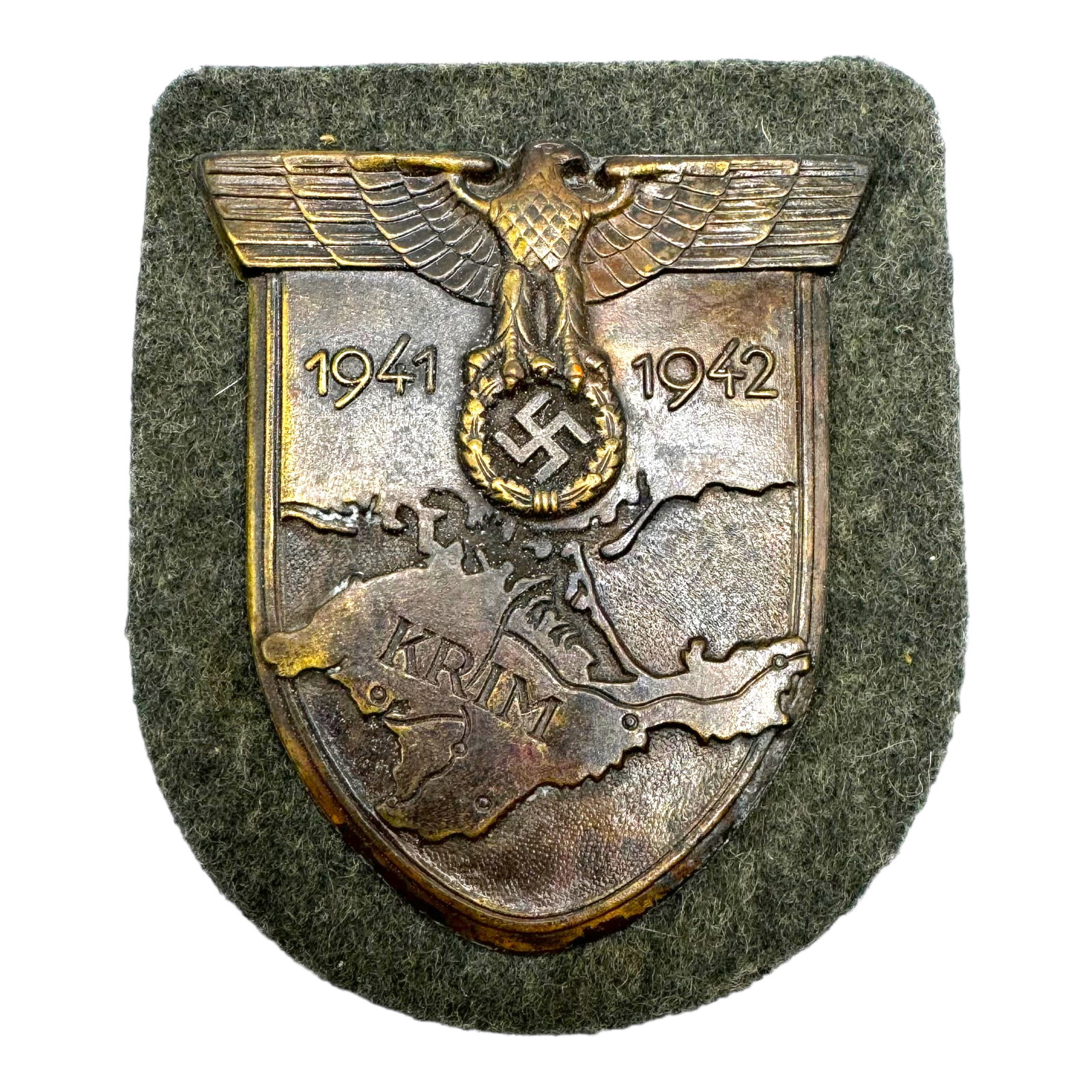 Third Reich Krim Shield - Heer Krimschild: (Heer Krimschild). Constructed of a bronzed zink alloy, the obverse consisting of a shield bearing a raised map of Crimea and southern Ukraine, topped by a Wehrmacht eagle clutching a wreathed mobile 