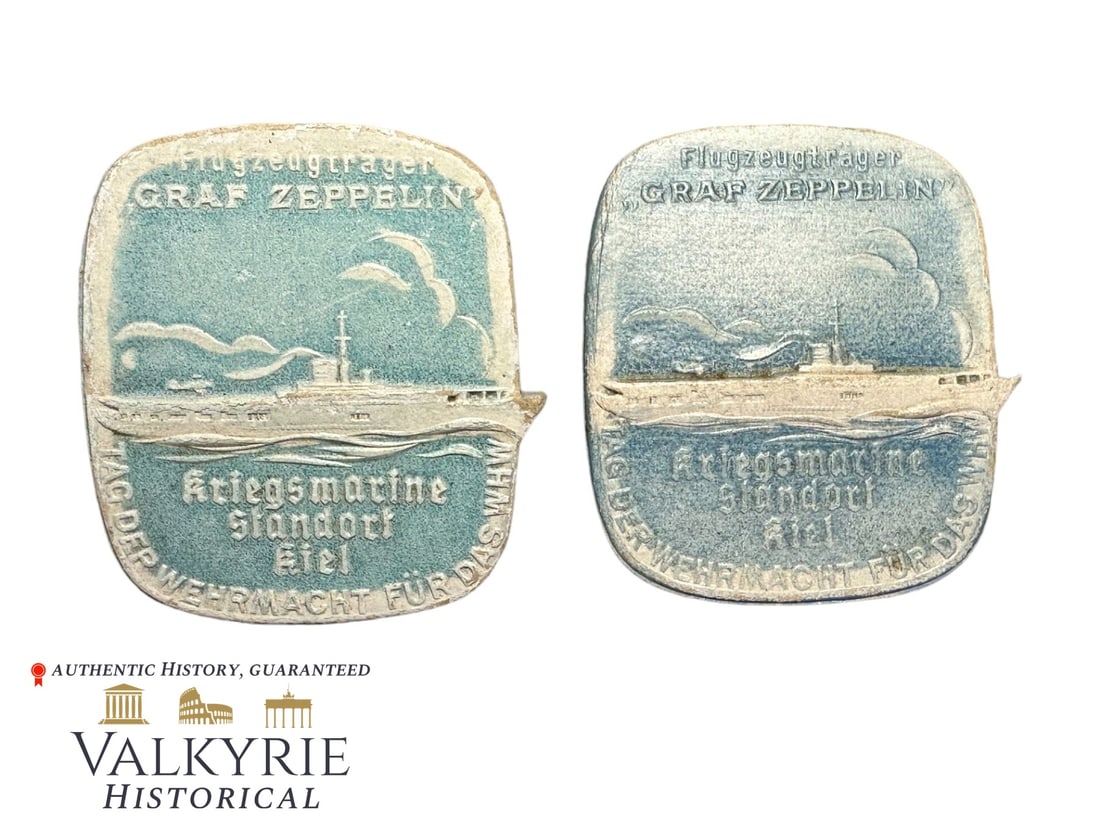 2 Identical Commemorative Badges "Day of the Wehrmacht for the WHW - Kriegsmarine Kiel": 2 Identical Commemorative Badges "Day of the Wehrmacht for the WHW - Kriegsmarine Standort Kiel - Aircraft Manufacturer Graf Zeppelin". One is complete with the needle system working perfectly and the