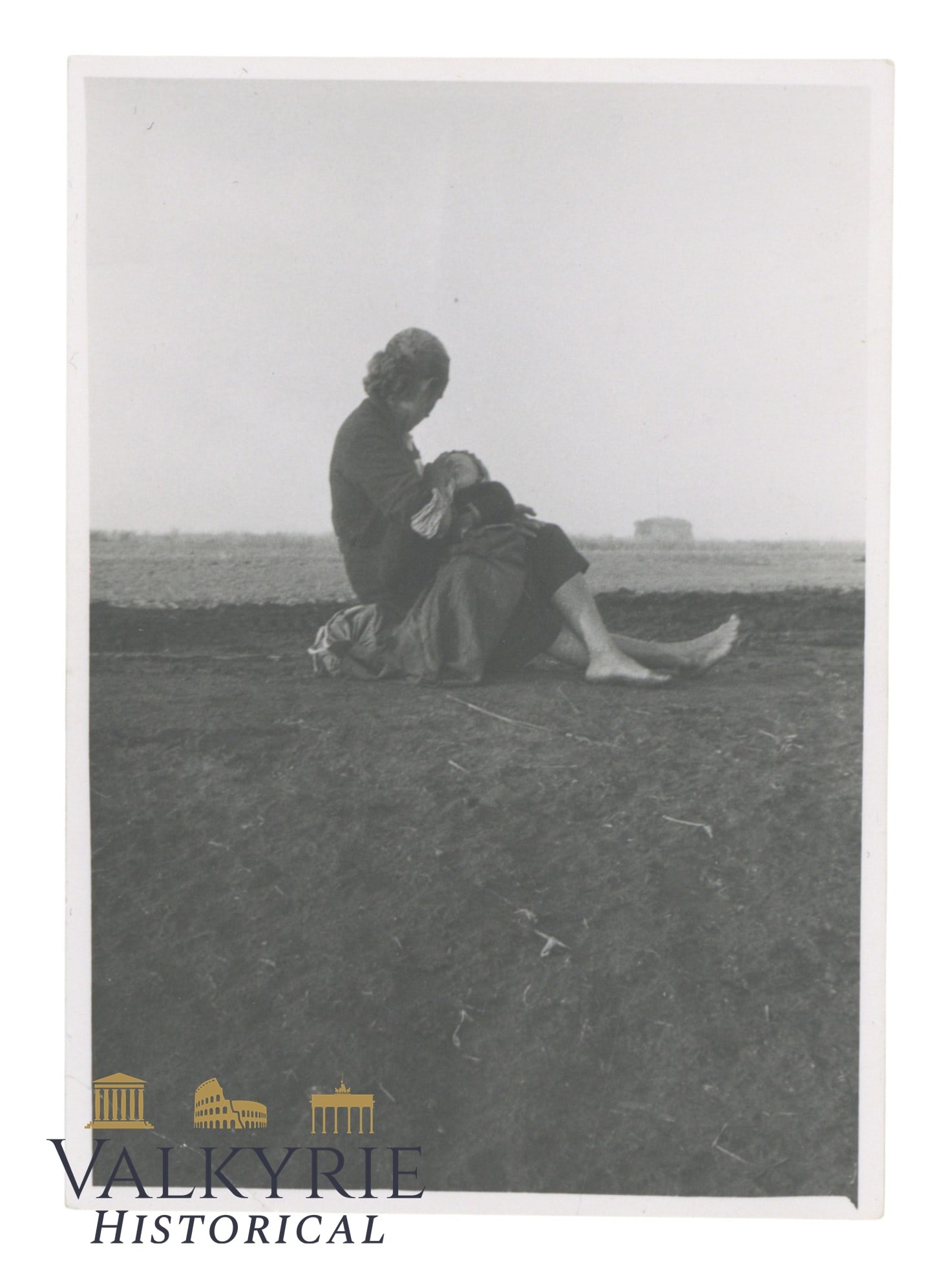 Touching Photo Showing a Woman Probably During the War in the East Feeding His Baby: Touching Photo Showing a Woman Probably During the War in the East Feeding His Baby or just taking care of him. She's barefoot and seemingly without any belonging. Size: 10x7cm .All items for this auc