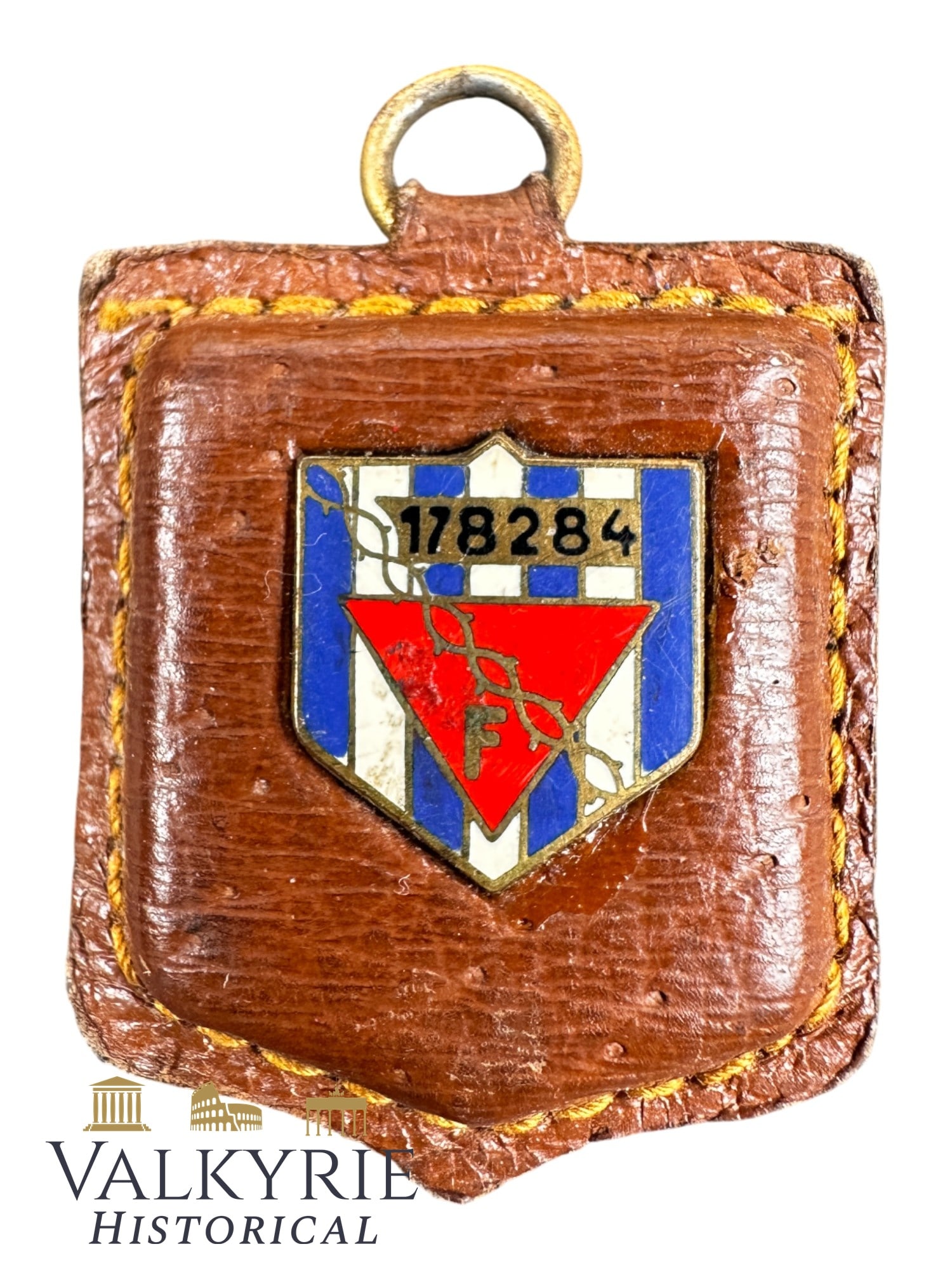 Souvenir Keychain Made For a Former French Political Prisoner in a German Concentration Camp: Souvenir Keychain Made For a Former French Political Prisoner in a German Concentration Camp. It's made from leather with an enameled shield with blue and white stripes like those of the prisoners' un