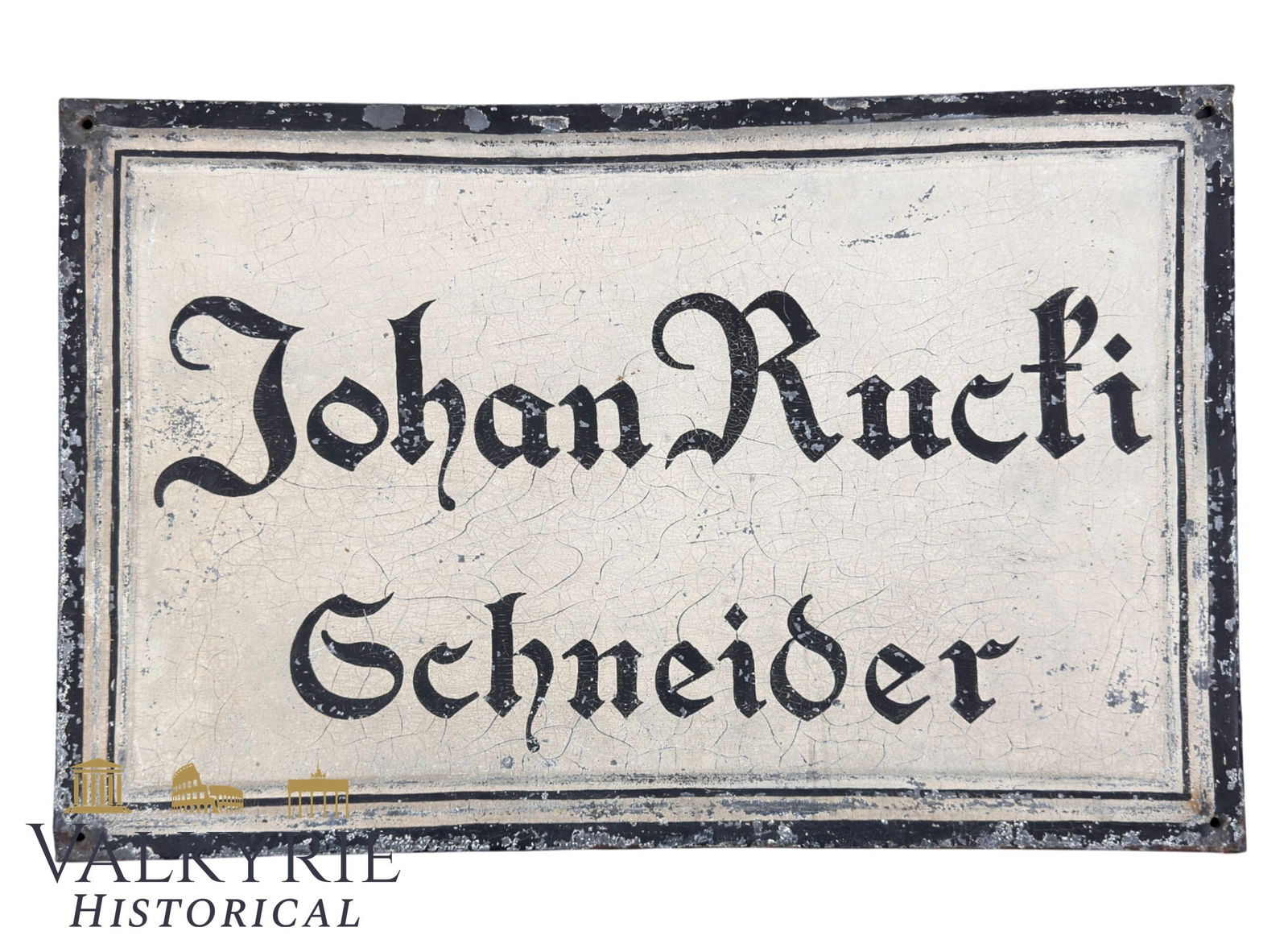 Antique Vintage Metal Sign “Johann Rucki Schmieder” – Old Tin Advertising Plaque: It is a hand-painted advertising sign on a metal sheet with the inscription “Johann Rucki – Schneider”, indicating a tailor’s workshop run by the owner bearing the name
