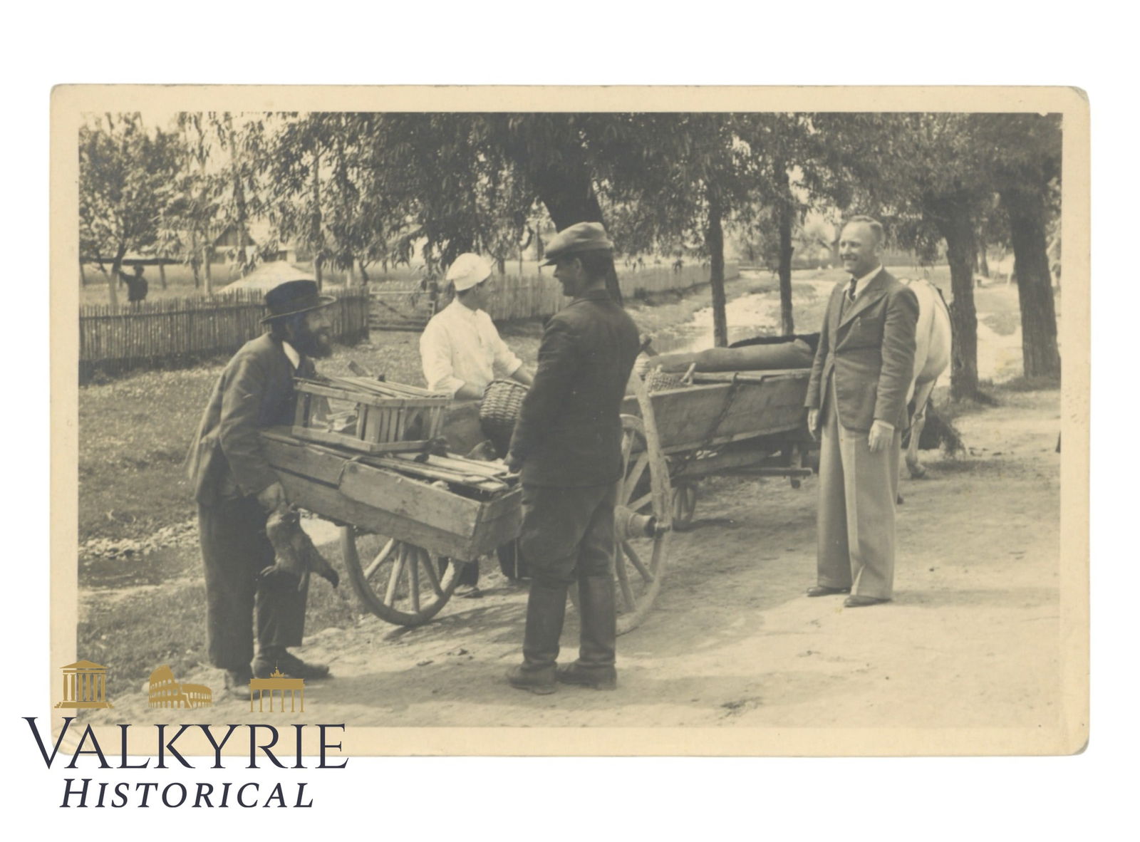 Photo of some Jews loading or unloading a carriage while an aryan man watches the process in postcar (1 of 2)