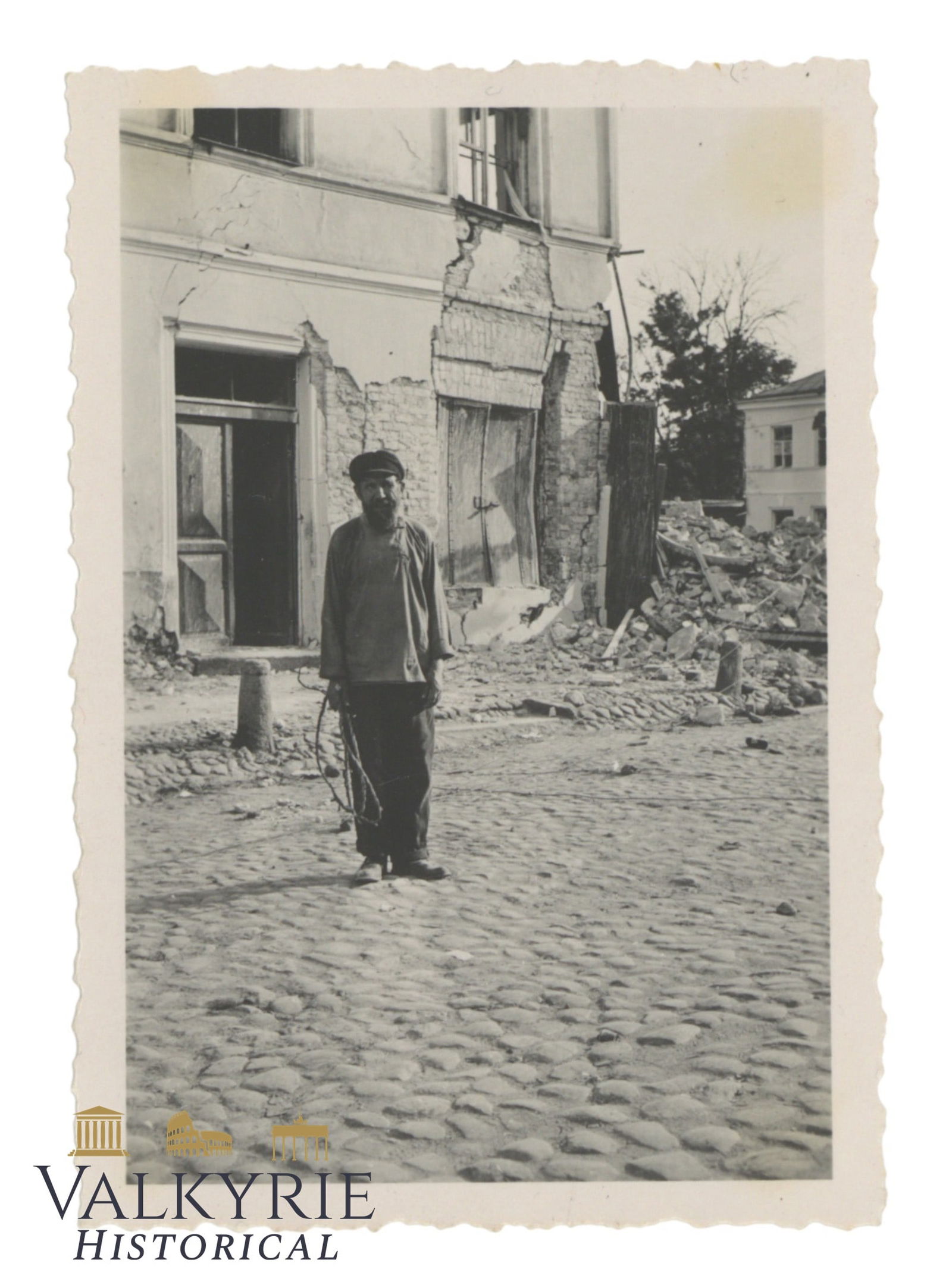 Photo of a Jew Posing with destroyed houses behind (1 of 2)